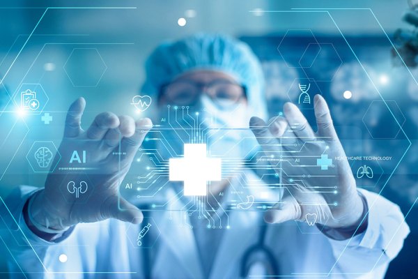 A medical professional wearing a surgical cap, mask, and gloves is seen interacting with a futuristic digital interface. The interface displays various healthcare-related icons, including a cross, AI symbols, DNA strands, and organs, overlaid on a transparent screen. The background is a blend of light blue and white hues, suggesting a clinical or high-tech environment. The professional's hands are outstretched as if manipulating the holographic data, emphasizing the integration of advanced technology and artificial intelligence in modern healthcare.